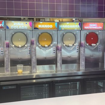Fat Tuesday - a row of soda machines in a restaurant - Cocktail Bars Near Me - Savannah, Georgia Fat Tuesday - a row of soda machines in a restaurant - Cocktail Bars Near Me - Savannah, Georgia