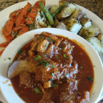 Mo's Restaurant - The oxtail with potatoes - Haitian Near Me - Key West, Florida Mo's Restaurant - The oxtail with potatoes - Haitian Near Me - Key West, Florida