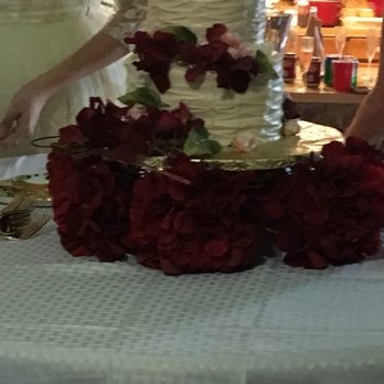 Quality Bakery - a bride and groom cutting their wedding cake - Bakeries Near Me - Gulfport, Mississippi Quality Bakery - a bride and groom cutting their wedding cake - Bakeries Near Me - Gulfport, Mississippi