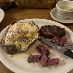 Medium rare filet loaded baked potato Medium rare filet loaded baked potato
