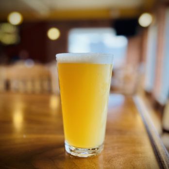 Kuhnhenn Brewing - a glass of beer on a bar - Breweries Near Me - Warren, Michigan Kuhnhenn Brewing - a glass of beer on a bar - Breweries Near Me - Warren, Michigan