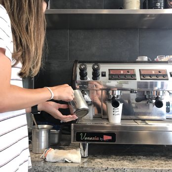 Corner Café - a woman preparing a cup of coffee - Coffee & Tea Near Me - Newport Beach, California Corner Café - a woman preparing a cup of coffee - Coffee & Tea Near Me - Newport Beach, California