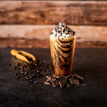 Ellianos Coffee - a glass of coffee with whipped cream and chocolate - Coffee & Tea Near Me - Eustis, Florida Ellianos Coffee - a glass of coffee with whipped cream and chocolate - Coffee & Tea Near Me - Eustis, Florida