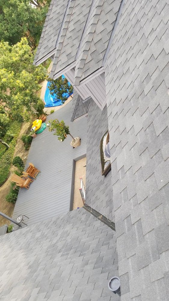 Slide of Cowtown Roofing