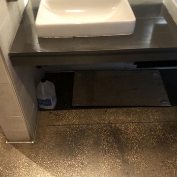 P.F. Chang's - Paneling that has fallen down from under the sink with chemicals just laying out. Not a top notch restaurant at all. - Chinese Near Me - Lubbock, Texas P.F. Chang's - Paneling that has fallen down from under the sink with chemicals just laying out. Not a top notch restaurant at all. - Chinese Near Me - Lubbock, Texas