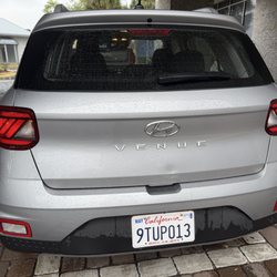Avis Rent A Car - Car has a dent, in the back. And I took this picture in front of Avis just fyi.