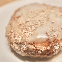 Parlor Doughnuts - Sandy Beach Doughnut. Original glaze with cinnamon powdered sugar on top. Super soft airy texture inside!