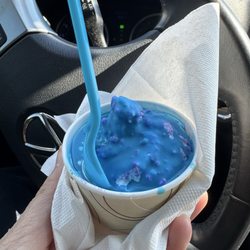 Junior size $3.95 -Blue cotton candy-July special. Blue raspberry soft serve dipped with candy pieces