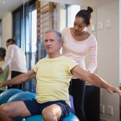 Spring Creek Medical Center - Elderly man during a physical therapy sessions in Logan