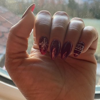 Zen Nails and Spa - Left hand, he got lazy and just did one snowflake. The pinky design is thick and not like the first hand - Waxing Near Me - Carmel, Indiana Zen Nails and Spa - Left hand, he got lazy and just did one snowflake. The pinky design is thick and not like the first hand - Waxing Near Me - Carmel, Indiana