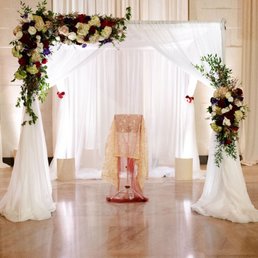 Wedding ceremony set up, including drapery and Chuppah from TeamImpulse.