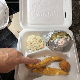 a person holding a container of food