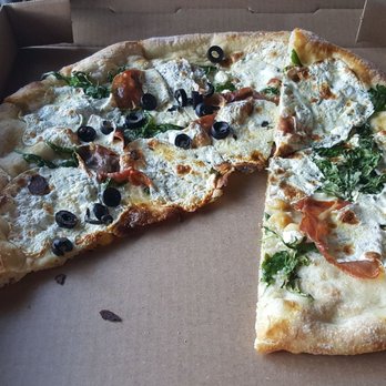 Tony C's - Prosciutto and pesto pizza with roasted garlic. - Pizza Near Me - Austin, Texas Tony C's - Prosciutto and pesto pizza with roasted garlic. - Pizza Near Me - Austin, Texas