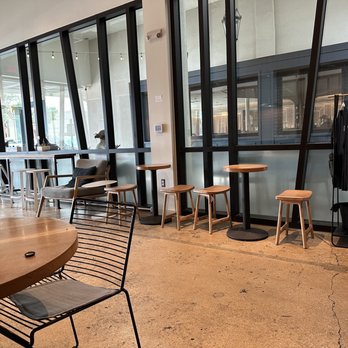 Merit Coffee - tables and chairs in a coffee shop - Coffee & Tea Near Me - Dallas, Texas