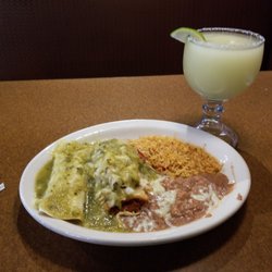 El Tapatio Mexican Restaurant - Pick 2 combo. Chicken burrito, tamale, rice, & beans with salsa verde.