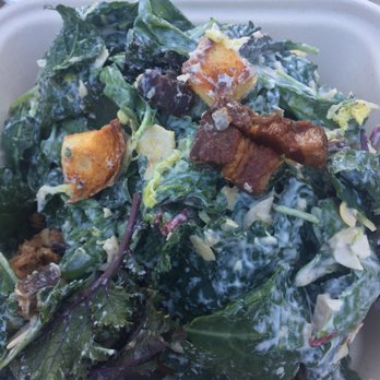 Mammoth Brewing - The underside of the same salad featuring the bacon lardon and house made croutons on a bed of kale, arugula and shaved Brussel sprouts. - Breweries Near Me - Mammoth Lakes, California