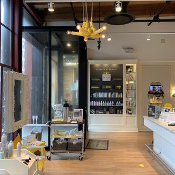Drybar - Milwaukee - Products and reception desk and water and coffee service for guests - Blow Dry/Out Services Near Me - Milwaukee, Wisconsin