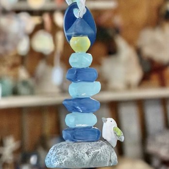 The Sand House - Sea glass lighthouse ornament of stacked blue glass on a gray rock with a small bird - Home Decor Near Me - Point Pleasant Beach, New Jersey The Sand House - Sea glass lighthouse ornament of stacked blue glass on a gray rock with a small bird - Home Decor Near Me - Point Pleasant Beach, New Jersey