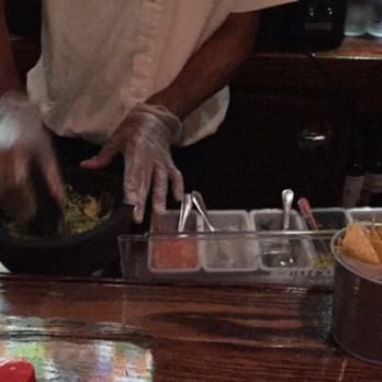 Chihuahua - Bartender making the guacamole - Mexican Near Me - Sunnyside, New York Chihuahua - Bartender making the guacamole - Mexican Near Me - Sunnyside, New York