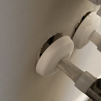 Cannon Builders - Holes exposed behind powder room sink - General Contractors Near Me - Troy, Missouri