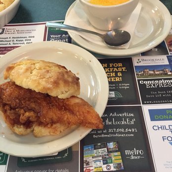 Metro Diner - Fried chicken tenderloin with spicy honey on a biscuit - awesome! Cheesy grits on the side. - Diners Near Me - Indianapolis, Indiana