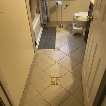 CM Construction - Dark and old tile job instead of baseboards like I asked for on previous renovation... - General Contractors Near Me