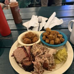 Brisket, pulled pork, hush puppies, and fried okra Brisket, pulled pork, hush puppies, and fried okra