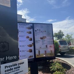 a sign in front of a mcdonald's
