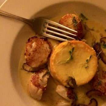 Black Cat Bistro - Scallops and corn pudding with brown butter sauce and sautéed mushrooms - New American Near Me - Cambria, California Black Cat Bistro - Scallops and corn pudding with brown butter sauce and sautéed mushrooms - New American Near Me - Cambria, California
