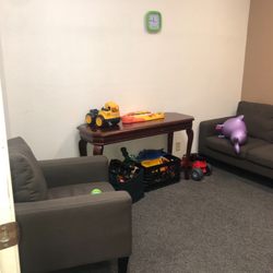 Autism Center - Patient room filled with toys and comfortable coaches