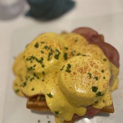 People’s Waffle - The Benny Poached eggs*, hollandaise sauce, Canadian Bacon and a dash of cayenne and paprika. $14