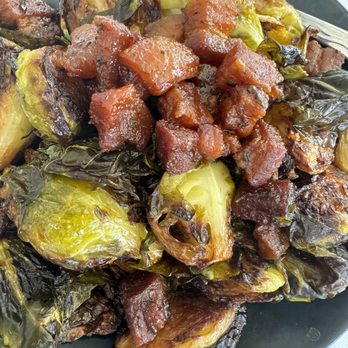 Spinners Rooftop Grille - Brussel sprouts with pork belly - Lounges Near Me - St. Pete Beach, Florida Spinners Rooftop Grille - Brussel sprouts with pork belly - Lounges Near Me - St. Pete Beach, Florida