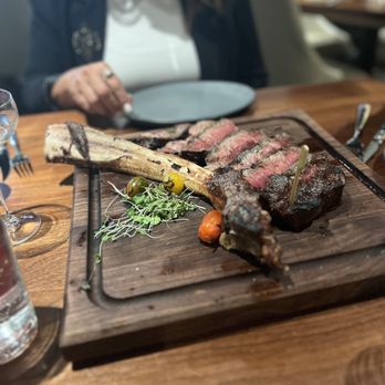CUT132 - Another view of the HUGE tomahawk steak. - Steakhouses Near Me - Columbus, Ohio