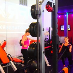 Prime Fitness RX - Trainer with client...