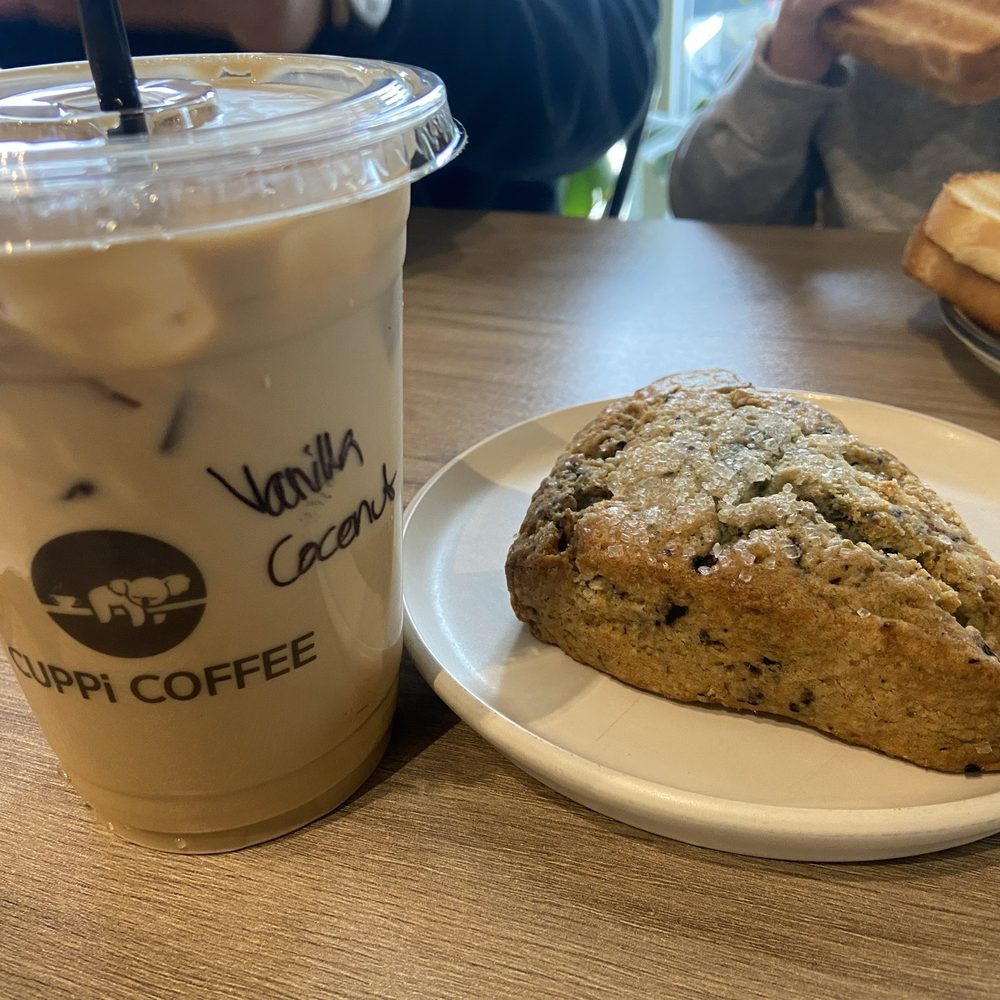 Cuppi Coffee - Blueberry scone, vanilla coconut latte with oat milk - Coffee & Tea Near Me - Dumfries, Virginia Cuppi Coffee - Blueberry scone, vanilla coconut latte with oat milk - Coffee & Tea Near Me - Dumfries, Virginia