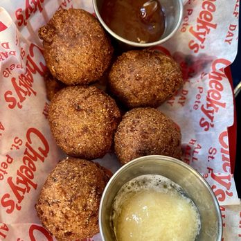 Cheeky's - Cornbread hush butters with guava jelly - Seafood Near Me - St. Petersburg, Florida Cheeky's - Cornbread hush butters with guava jelly - Seafood Near Me - St. Petersburg, Florida