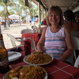 Jackie found her paella! She looks happy