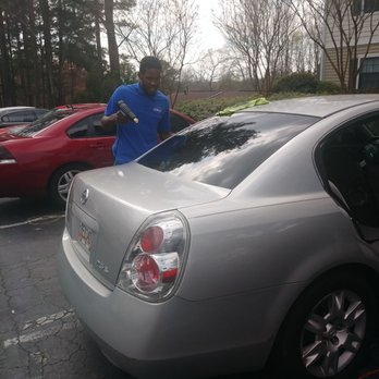 Xpert Window Tint - Master tint making sure tint is laid flat - Car Window Tinting Near Me - Decatur, Georgia Xpert Window Tint - Master tint making sure tint is laid flat - Car Window Tinting Near Me - Decatur, Georgia