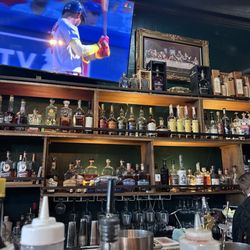 Barcuso - Sitting at the bar. Great selection of whiskey.