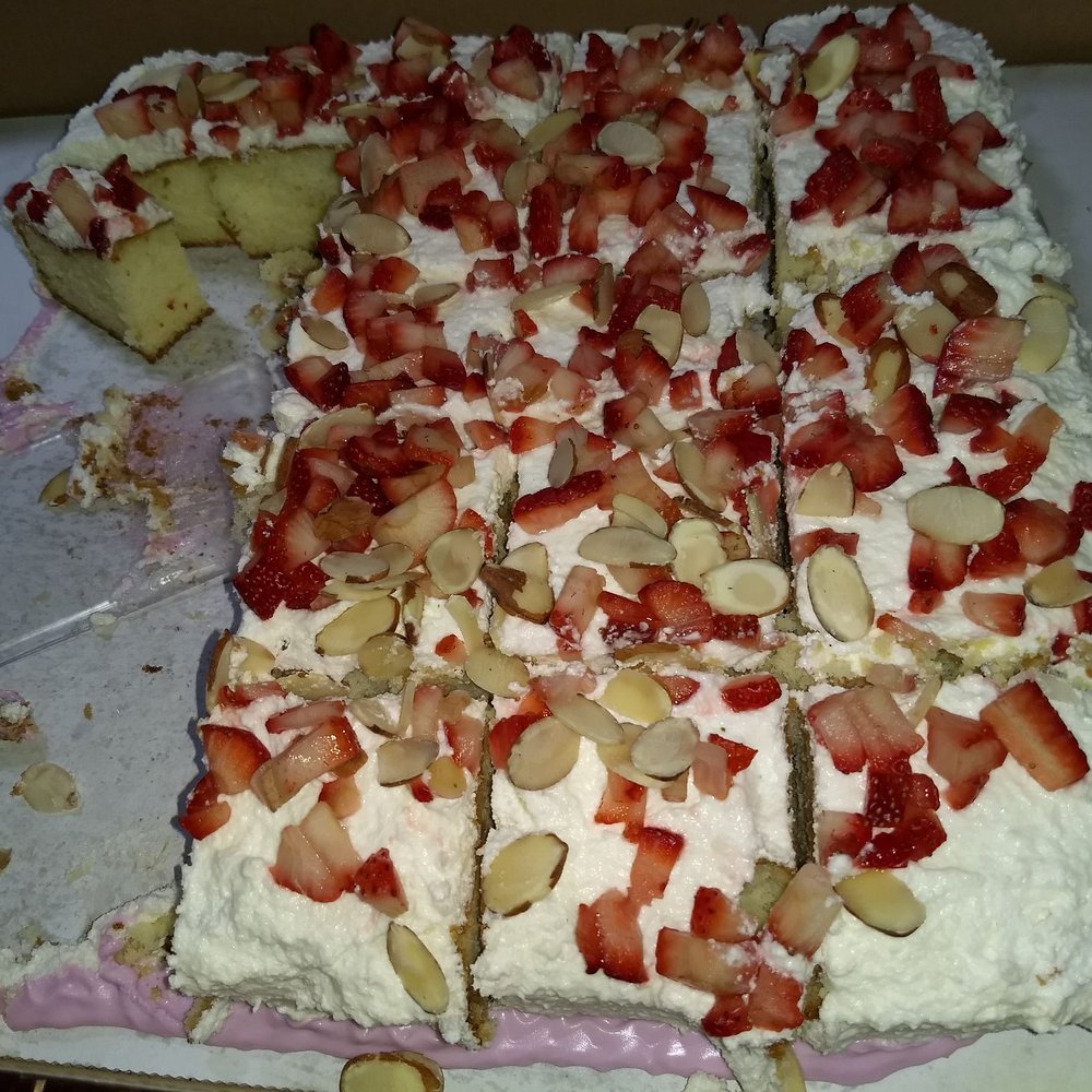 Pink's Parties - a cake with strawberries and almonds - Bakeries Near Me
