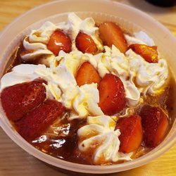 Vicious Biscuit - Maple syrup strawberries and whipped cream that come with the vicious beignets