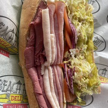 Beach Hut Deli - Look at this large sub, ham, pastrami, turkey, with the works. Very tasty about $14 ,, worth it! - Delis Near Me - Los Osos, California