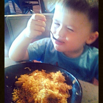 Tarka Indian Kitchen - My son eating the curry on the kids menu. I couldn't get him to look at me long enough before he returned to eating. He's 3... - Indian Near Me - Austin, Texas Tarka Indian Kitchen - My son eating the curry on the kids menu. I couldn't get him to look at me long enough before he returned to eating. He's 3... - Indian Near Me - Austin, Texas