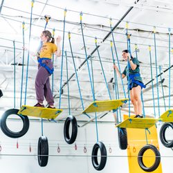 Group Dynamix - Two teachers enjoying one of our many ropes courses during a teacher in-service event.