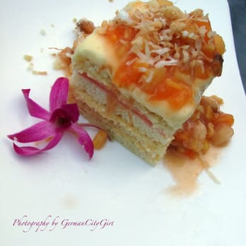 Palisade - Piña Colada cake - homemade vanilla-rum cake with guava-orange filling, coconut cream custard + tropical fruit compote. - Seafood Near Me - Seattle, Washington Palisade - Piña Colada cake - homemade vanilla-rum cake with guava-orange filling, coconut cream custard + tropical fruit compote. - Seafood Near Me - Seattle, Washington