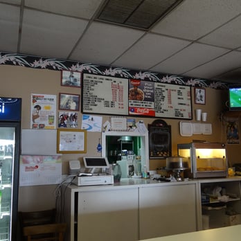 One Stop West Indies Restaurant - The counter where you order (if you look closely, you can see the menu and prices on the board of the back wall). - Caribbean Near Me - West Palm Beach, Florida One Stop West Indies Restaurant - The counter where you order (if you look closely, you can see the menu and prices on the board of the back wall). - Caribbean Near Me - West Palm Beach, Florida