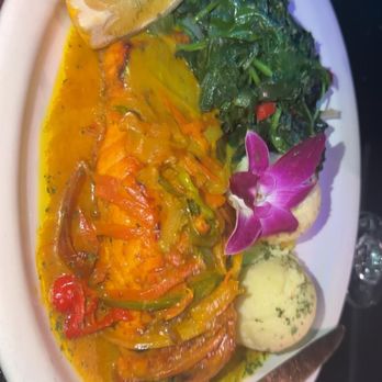 Vybez Restaurant and Lounge - Coconut curry salmon with garlic mashed potatoes and sauté spinach - Lounges Near Me - Mount Vernon, New York Vybez Restaurant and Lounge - Coconut curry salmon with garlic mashed potatoes and sauté spinach - Lounges Near Me - Mount Vernon, New York