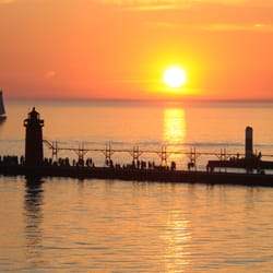 South Haven Visitors Bureau - South Haven is sunset central. With our iconic lighthouse as a backdrop each and every evening.