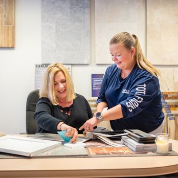 Total Flooring Systems - a woman and a woman sitting at a table - Flooring Near Me - Cape Coral, Florida Total Flooring Systems - a woman and a woman sitting at a table - Flooring Near Me - Cape Coral, Florida