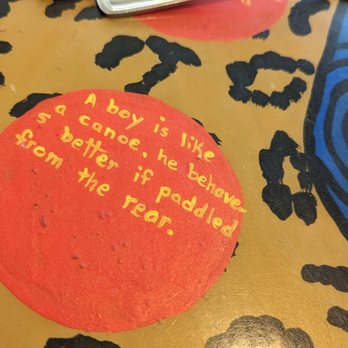 Bernie & the Boys Bistro - a red button with a message on it - Burgers Near Me - Drumheller, Alberta